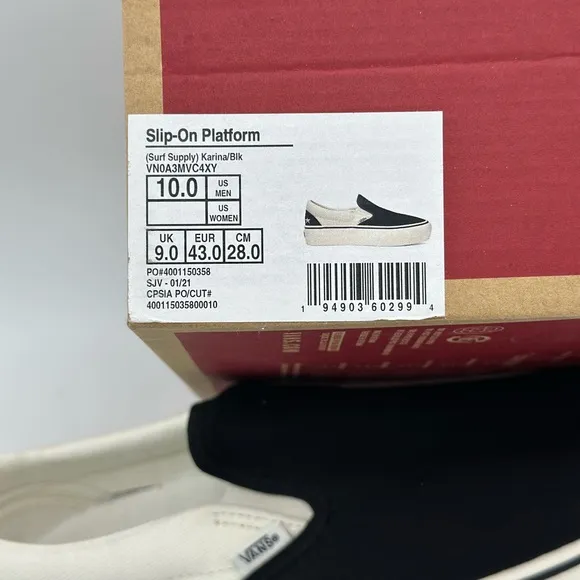 Vans Black and White Slip-On Sneakers