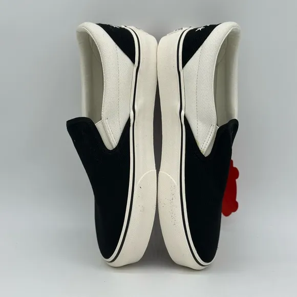 Vans Black and White Slip-On Sneakers