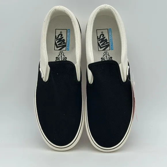 Vans Black and White Slip-On Sneakers
