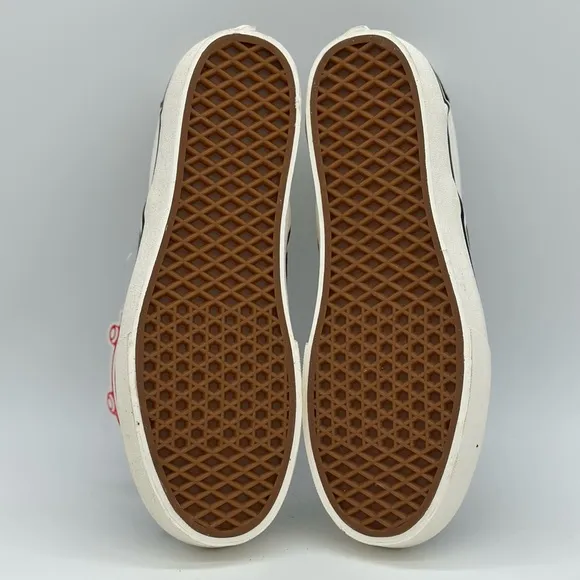 Vans Black and White Slip-On Sneakers